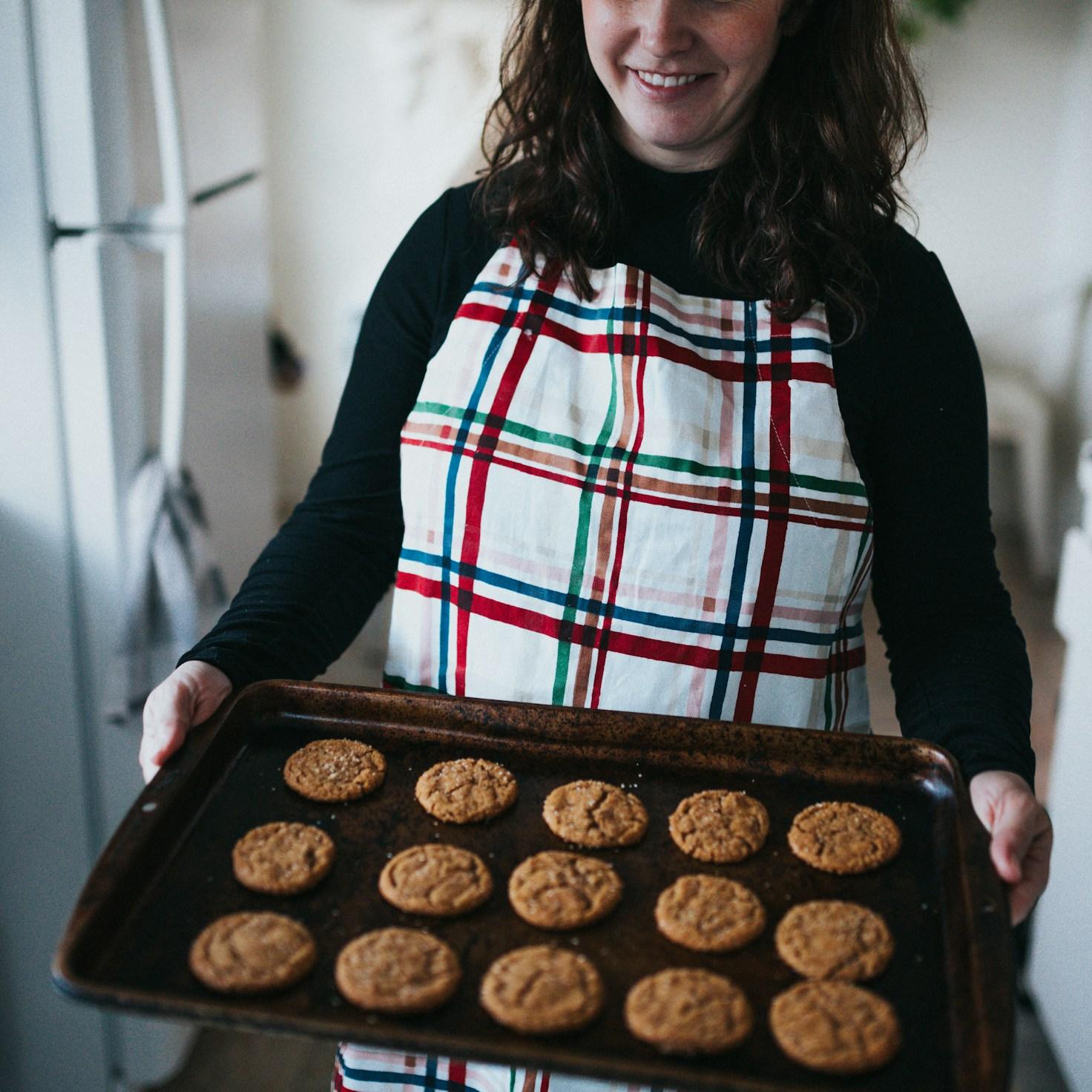 Community members collaborating in a modern kitchen space, sharing recipes and cooking techniques